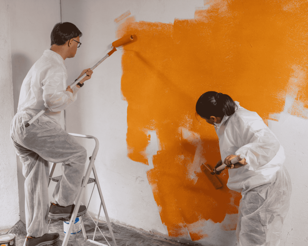 2 people painting 1 room flat in singapore in orange colour nippon paint