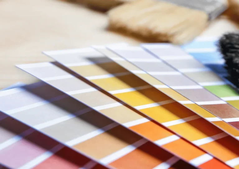 Paint colour swatches fanned out with paintbrushes